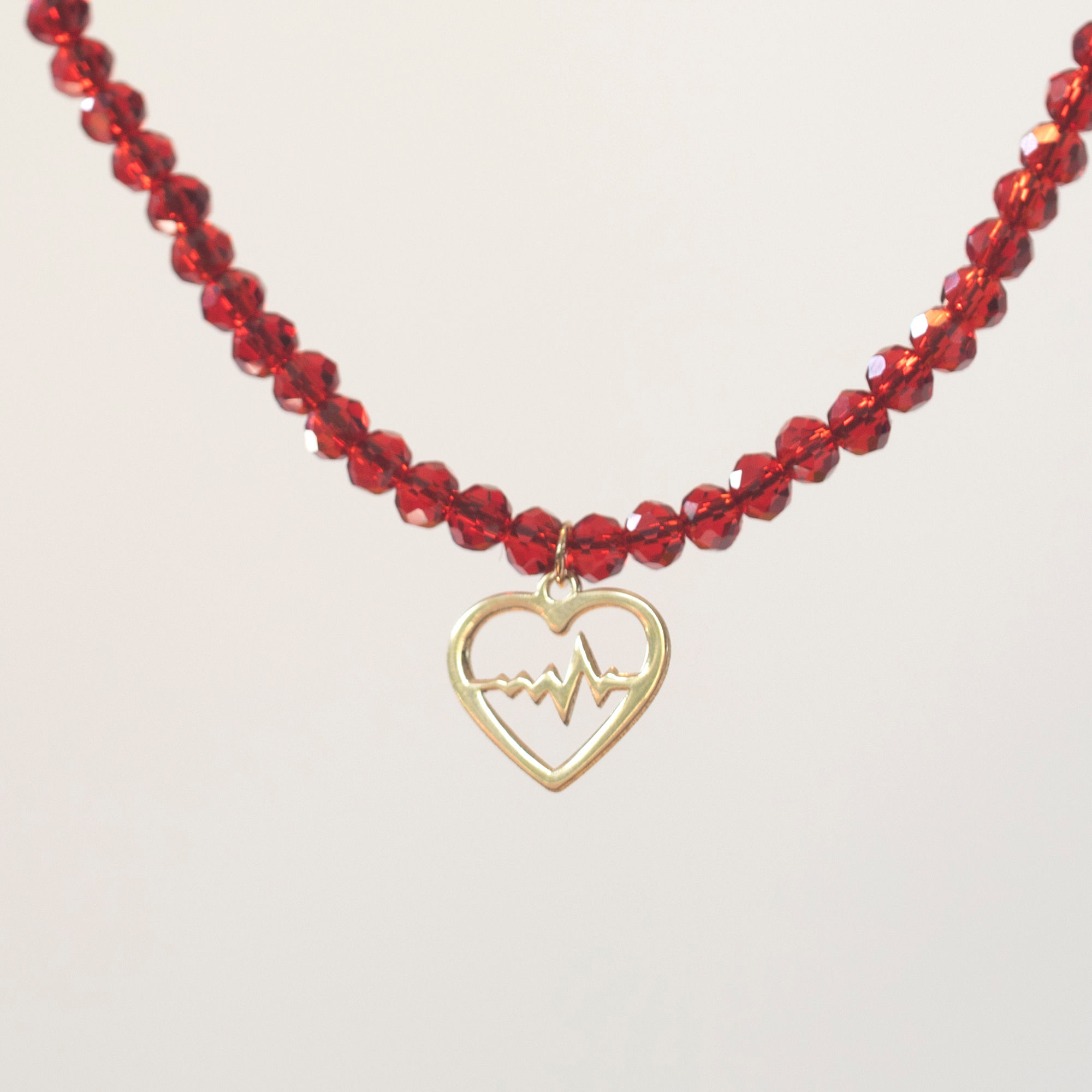 Custom 18K gold jewelry by Glowd Studio featuring fine details like diamonds, yellow sapphire, pearls, agate, jade, turq,sun.