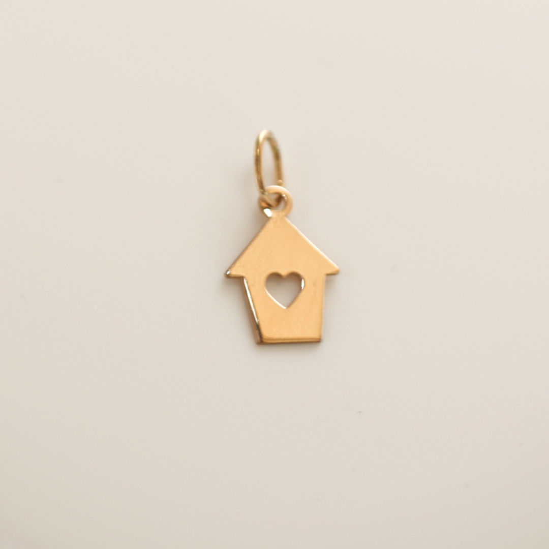 Custom 18K gold jewelry by Glowd Studio featuring fine details like diamonds, yellow sapphire, pearls, agate, jade, turquoise