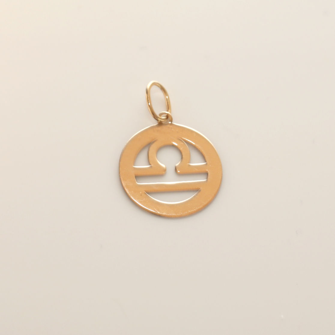 Custom 18K gold jewelry by Glowd Studio featuring fine details like diamonds, yellow sapphire, pearls, agate, jade, turquoise