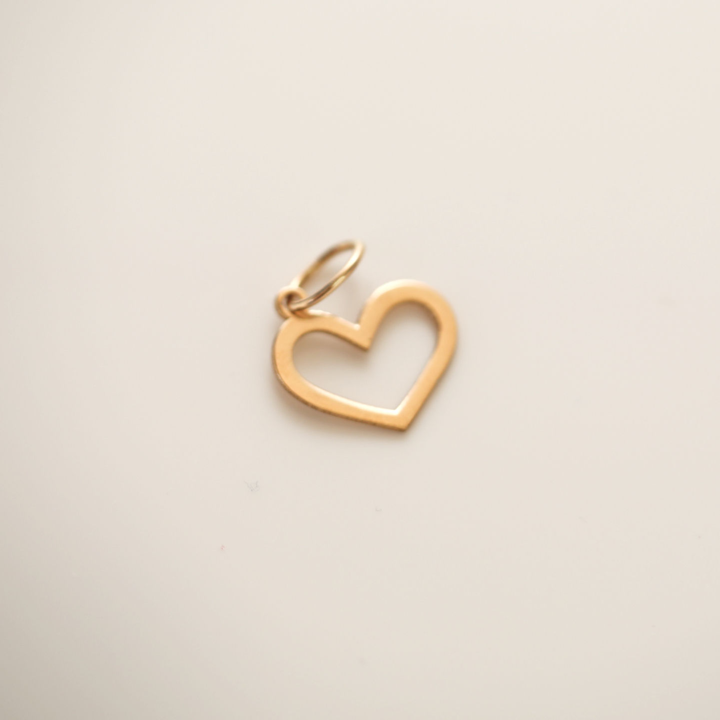 Custom 18K gold jewelry by Glowd Studio featuring fine details like diamonds, yellow sapphire, pearls, agate, jade, turquoise