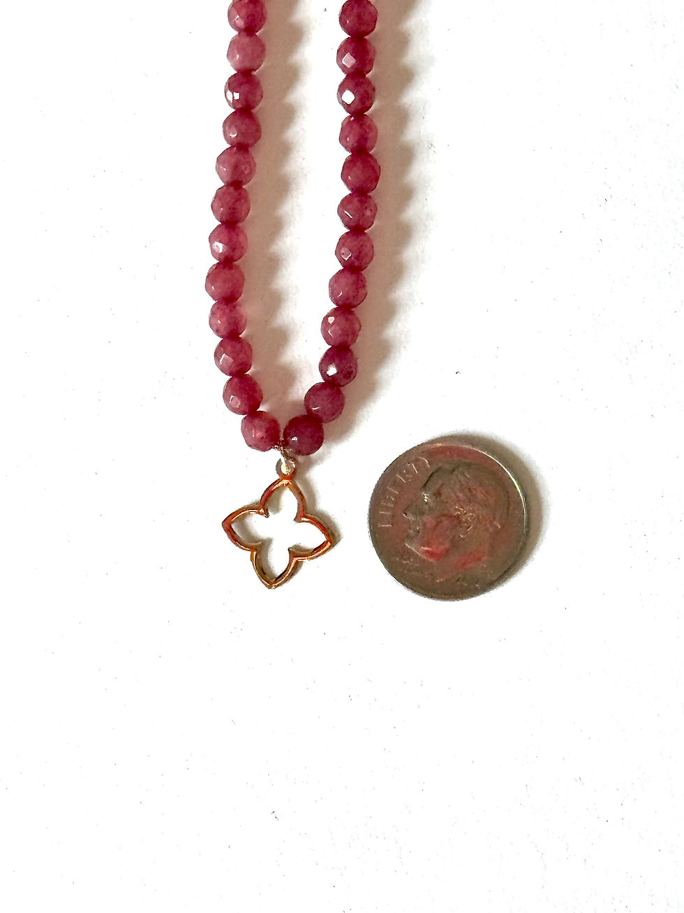 Custom 18K gold jewelry by Glowd Studio featuring fine details like diamonds, yellow sapphire, pearls, agate, jade, turq,sun.