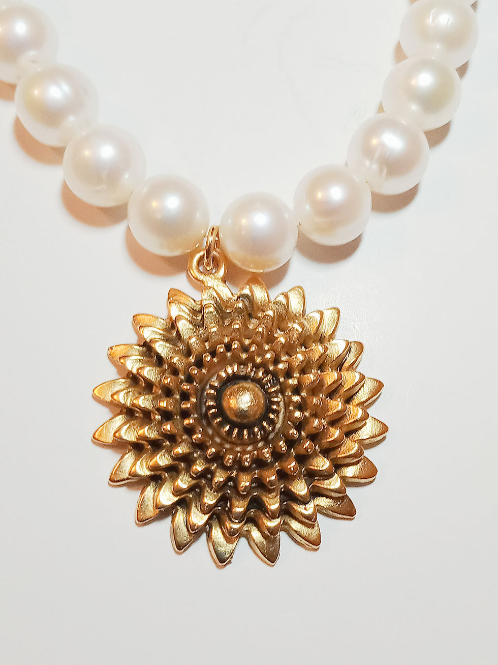 gold sunburst pendant front view