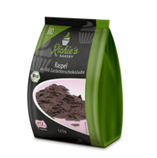 Standbeutel von „Richie's Bakery Raspel“ aus Bio-Zartbitterschokolade, 125 g, mit UTZ- und BIO-Siegel, grüner Seitenlasche und rosa Etikett.
