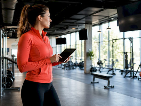 Manager controlling multi-zone screens in fitness studio