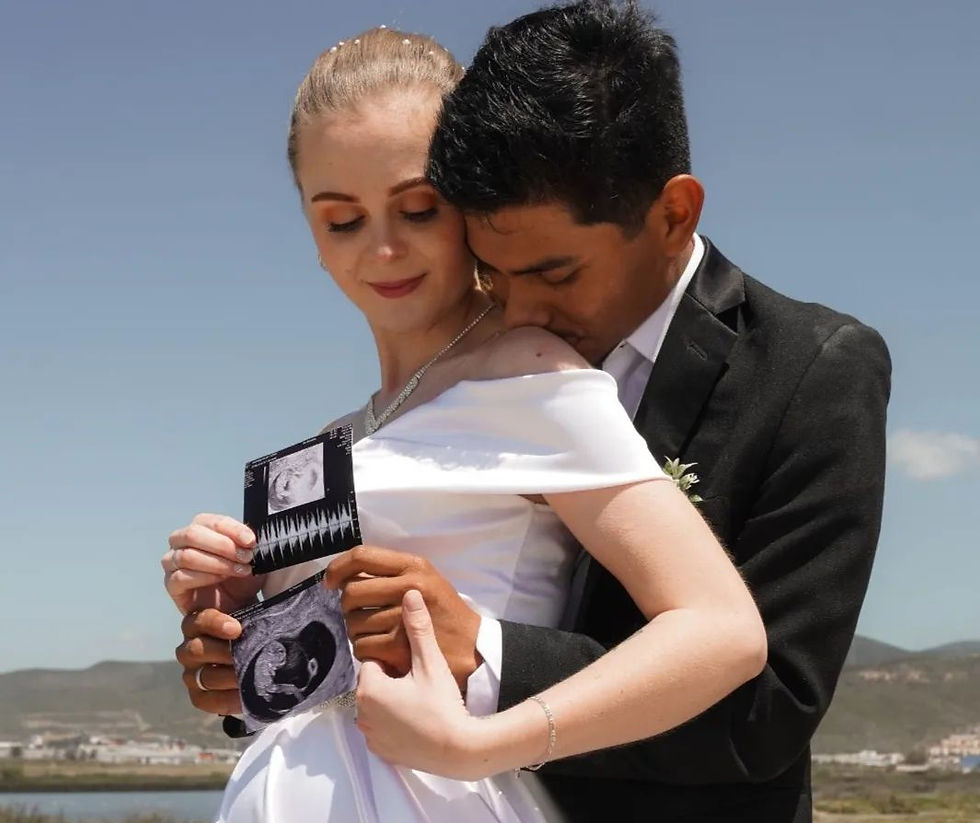 Wedding picture with pregnancy announcement