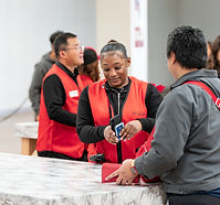 Outlet Employee helping customers with their deals