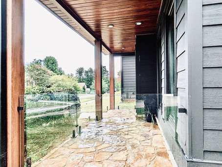 Apex Glass Industries crew installing a frameless glass porch railing in Cumming, Georgia