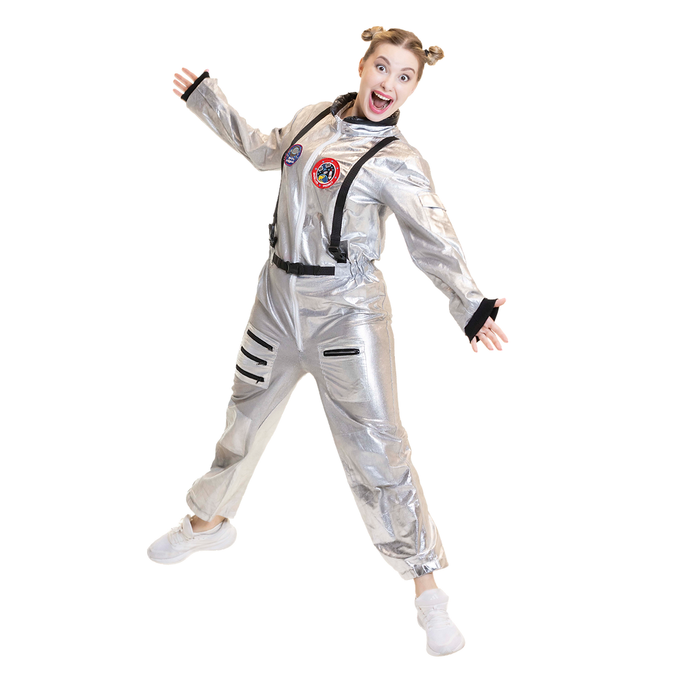 Shiny silver astronaut with mission patches, black straps and belt; hair in space buns, white sneakers, big grin - ready for playful liftoff.