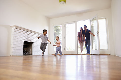 Excited Family Explore New Home On Moving Day.jpg