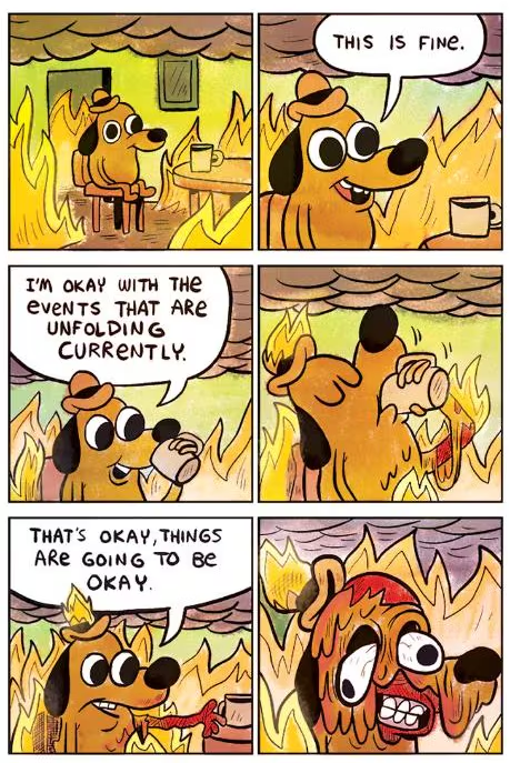 Šuo kambaryje liepsnose ramiai geria kavą; kalbos burbuluose: This is fine, I’m okay, Things are going to be okay.