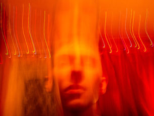 A man's face surrounded by flames