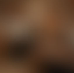 A wide shot of a hospital back office, heavily decorated with over-the-top Thanksgiving decorations across multiple desks and cubicles.