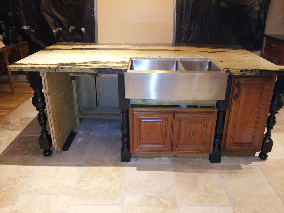 Kitchen redesign by Mackintosh Drafting featuring upgraded modern appliances, and a reimagined layout for improved flow and functionality.