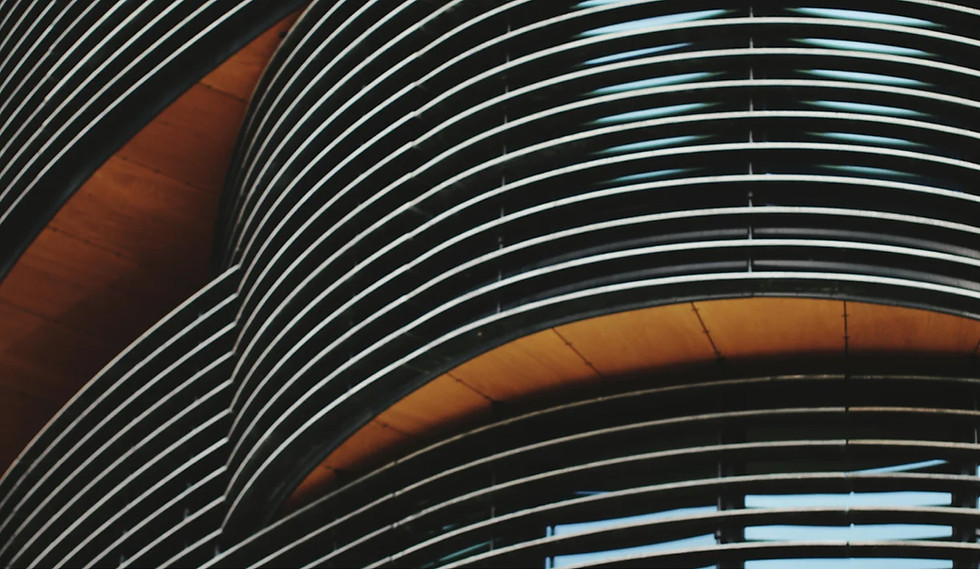 Close-up image of a modern, curved building