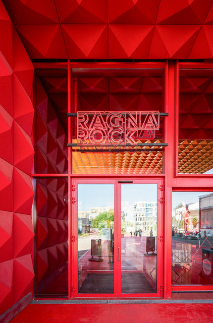 Contemporary red interior entrance with faceted wall surfaces