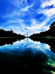 Washington Monument reflected in Reflecting Pool with dramatic clouds, Washington D.C.