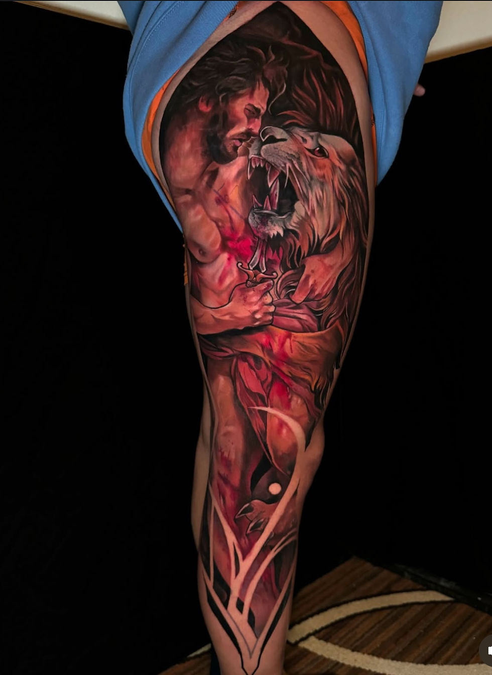 Man fight animal tattoo by Geri large at Tattoolicious Waikiki