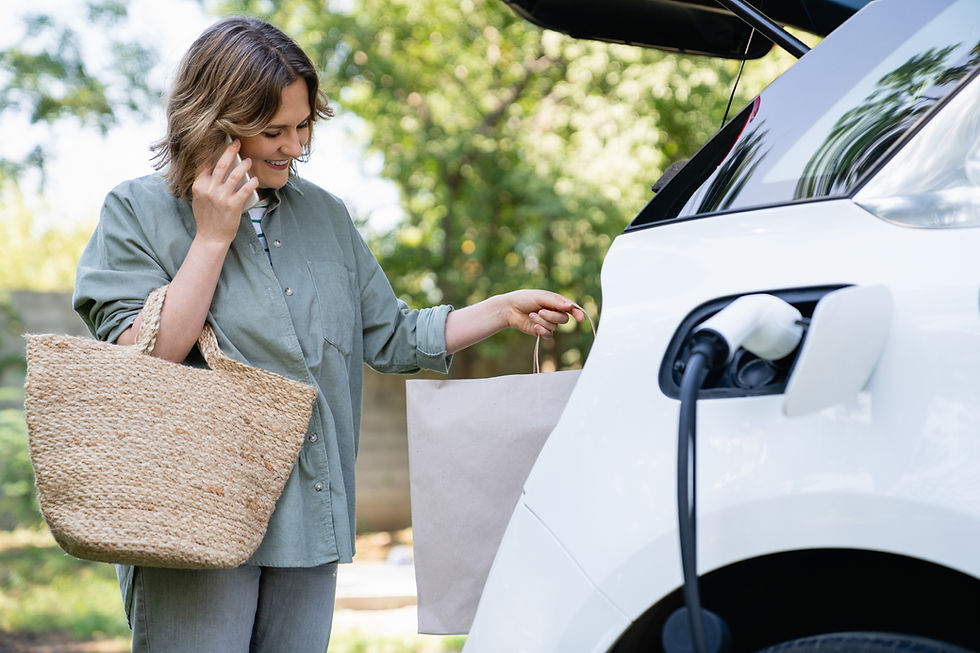 Woman charging EV after shopping