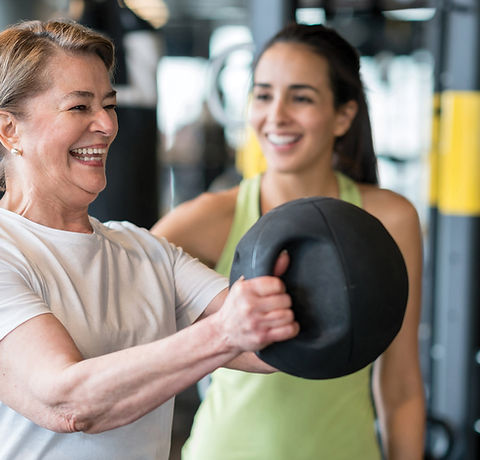 Personal trainer working with woman