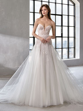 Sweetheart neckline, drop waist aline gown featuring beading a tulle.