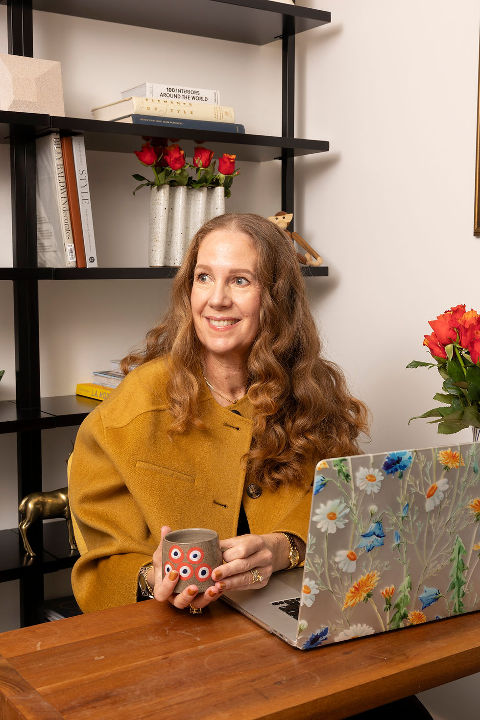 Lyn Cowie writing at her desk, reflecting her editorial approach to interiors, travel, and design 