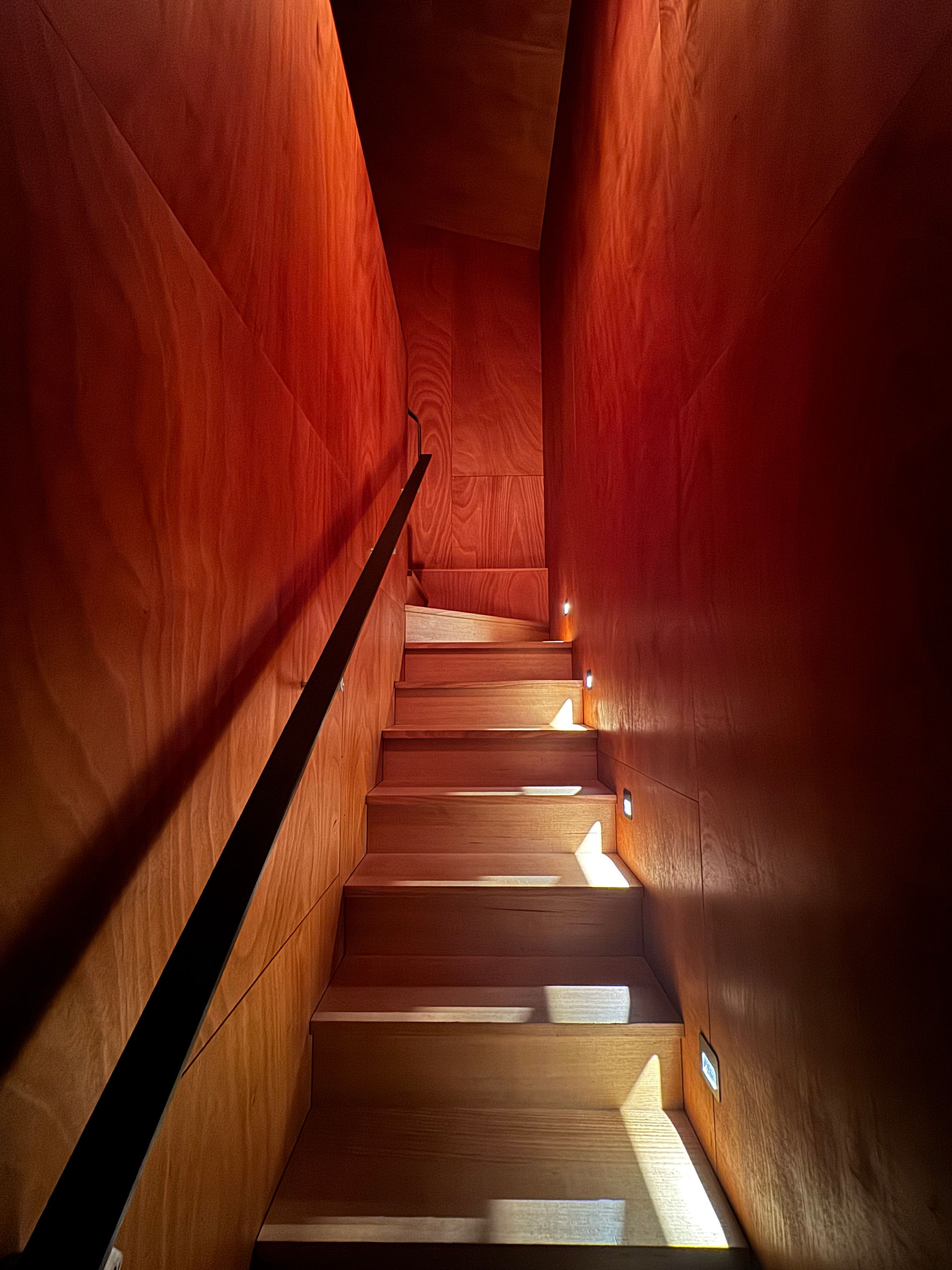 Warm lit wooden staircase design