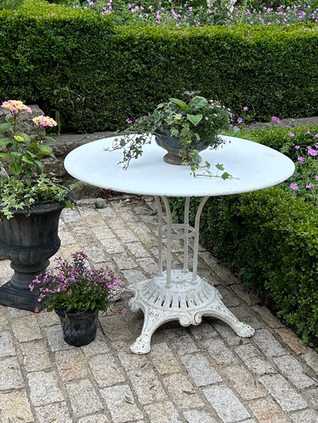 Cast iron garden table on attractive base.