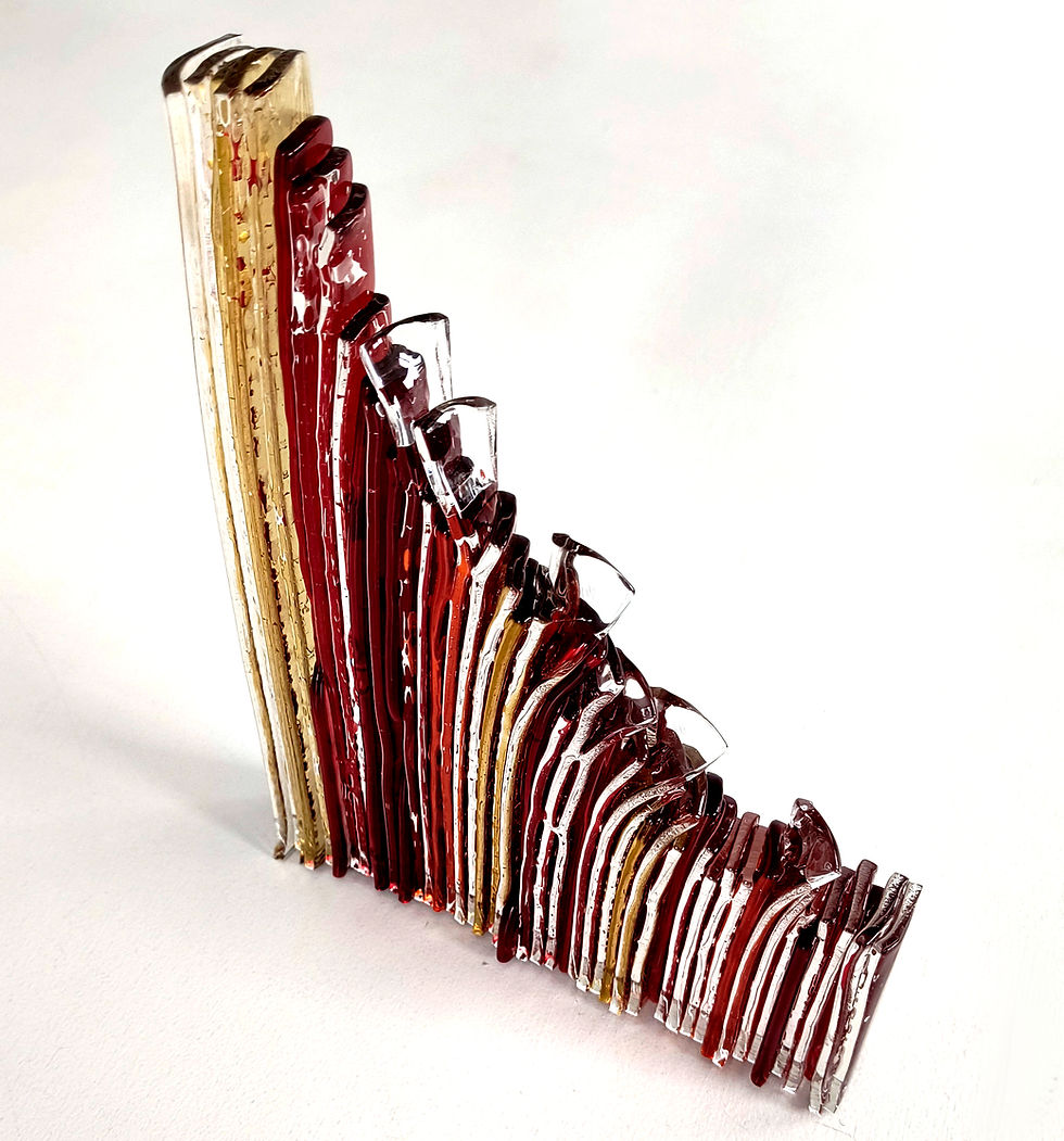 Thumbnail: Red and amber angled abstract fused glass sculpture