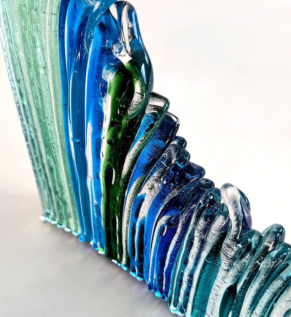 Thumbnail: Blue and clear abstract freestanding fused glass sculpture