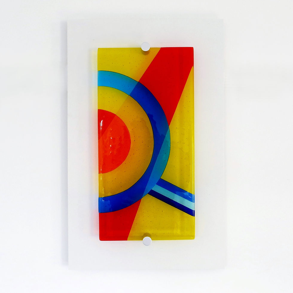 Thumbnail: Colourful, geometric fused glass wall art handmade in the UK