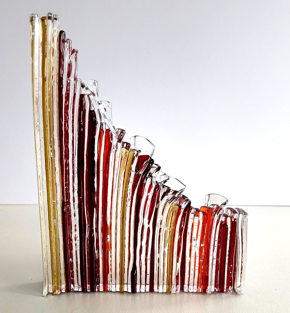 Thumbnail: Red, orange and yellow abstract fused glass sculpture