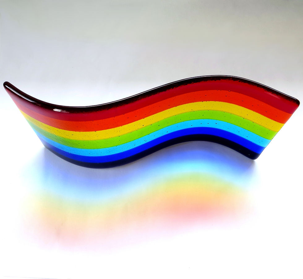 Thumbnail: Freestanding rainbow fused glass wave