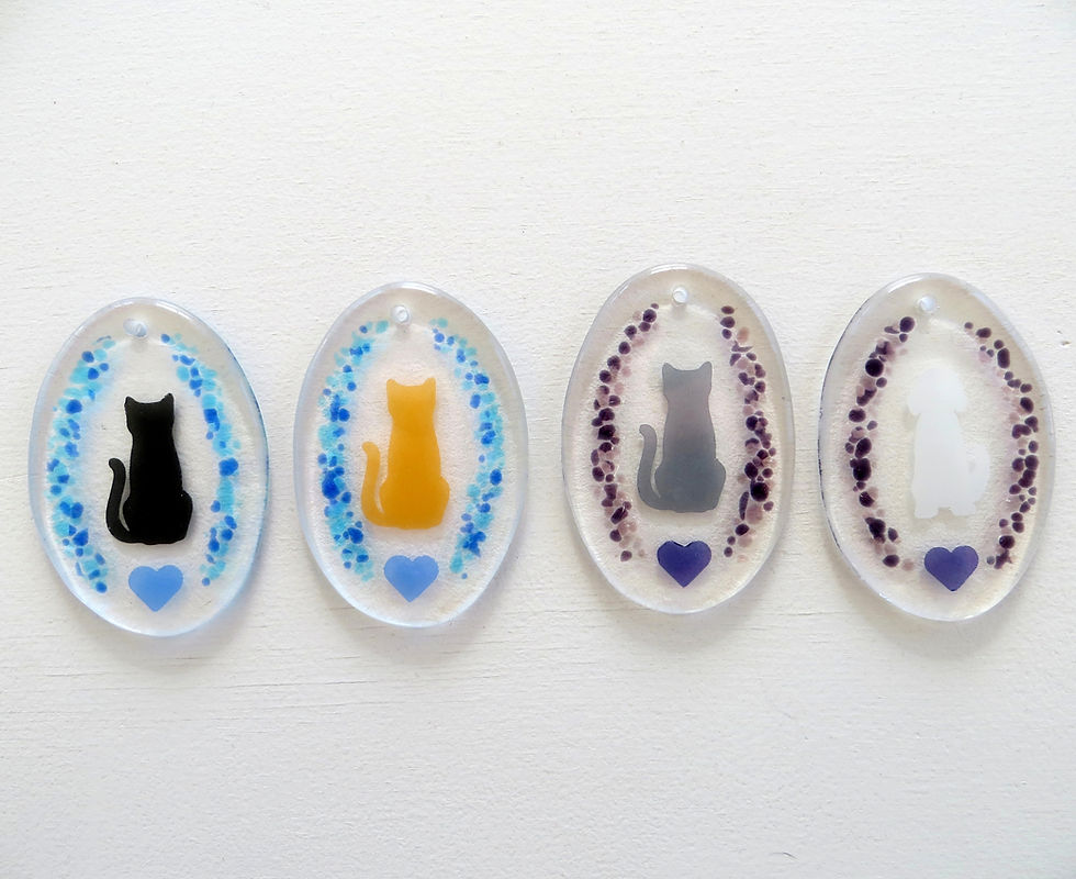 Commissioned fused glass cat and dog hangings