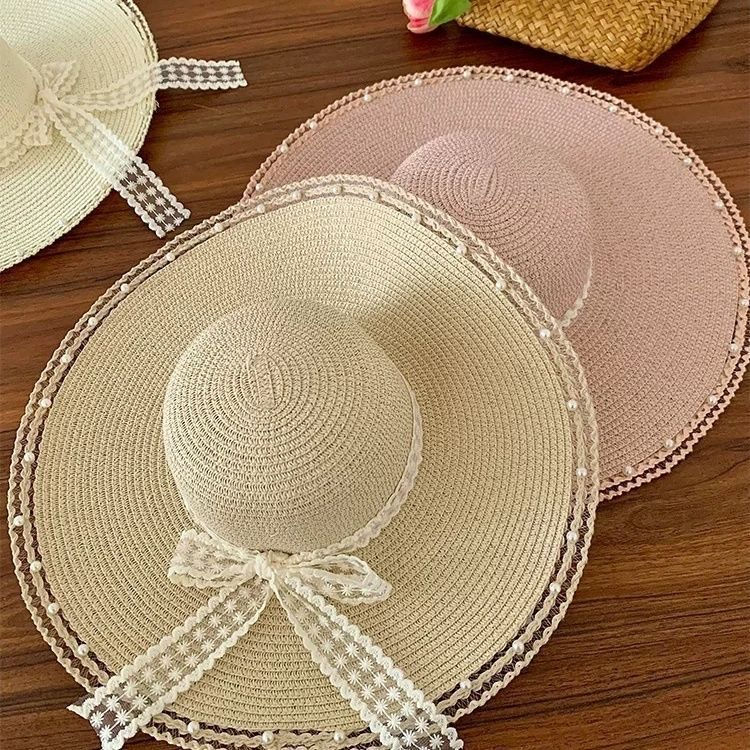 Thumbnail: Pearl-Embellished Wide Brim Hat Topped with a Delicate Lace Bow