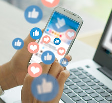 social media management phone and computer with social likes