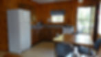 Kitchen, eating area, and side deck