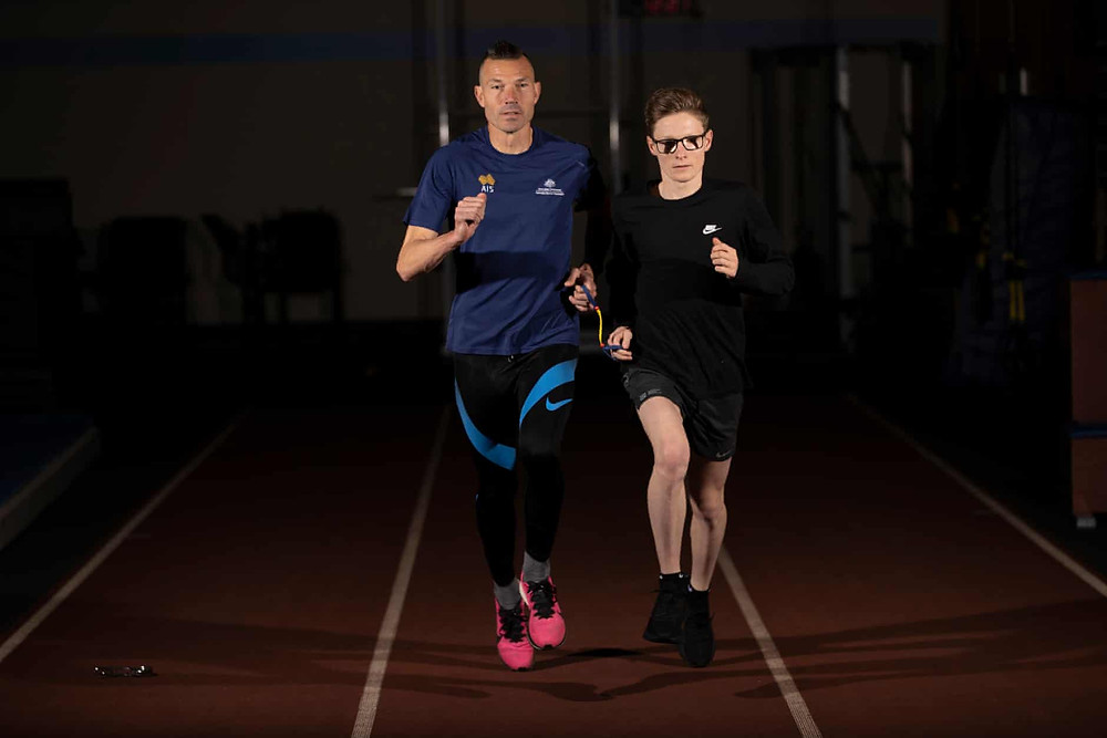 Jaryd Clifford is an Australian Paralympic, vision impaired, middle-distance athlete. He is running with his guide runner.