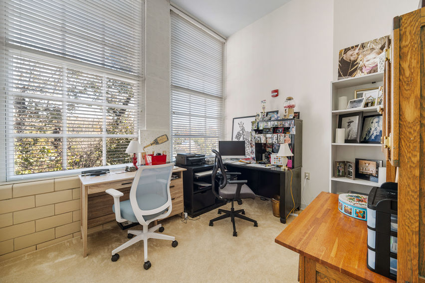 A photo of a bedroom that was converted into an office space.