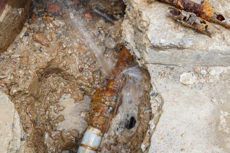 Cracks in a home’s foundation caused by soil erosion from a sewer line leak