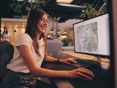 Placemark design technician reviewing a master plan on screen