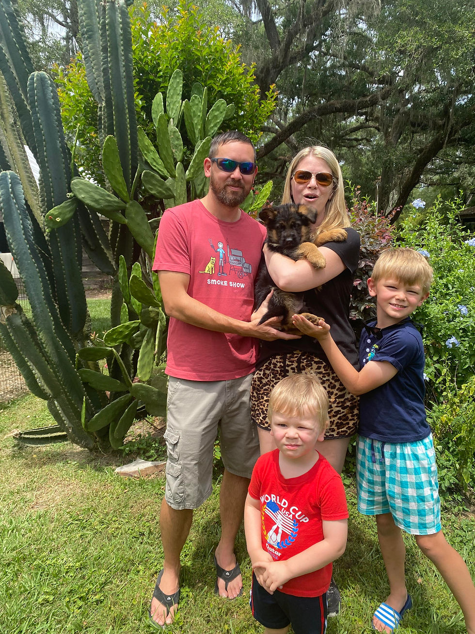 family receiving German Shepherd puppy breeder transition to new home Southernwind Kennels