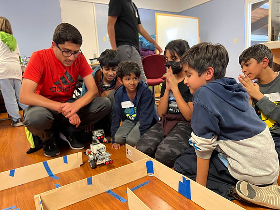 Kids looking at EV3 MINDSTORMS Robot at BASA.