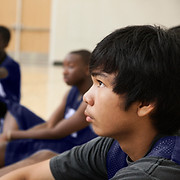 Basketball Players Listening to Coach