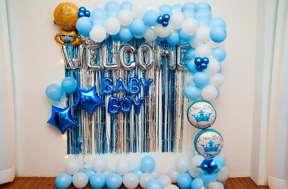 Welcome Baby Boy banner with blue and white balloons, silver curtain backdrop.