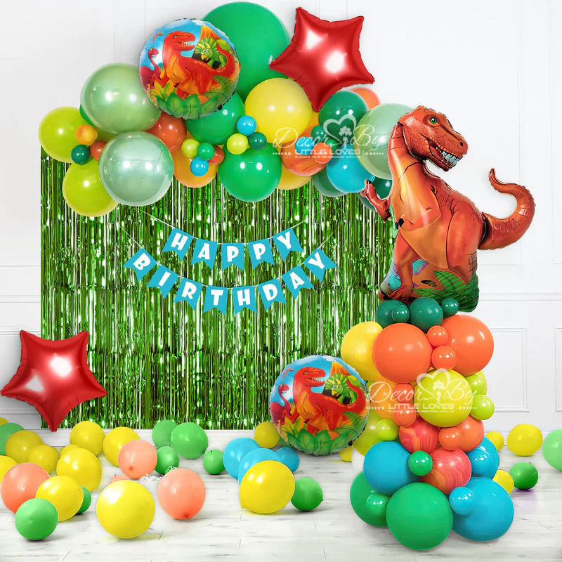 Colorful dinosaur-themed birthday decorations with shiny balloons say Happy Birthday. Dinosaur Theme Wall Decor.