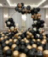 Black and gold balloon arch and floor decor, Decor By Little Loves, for event.