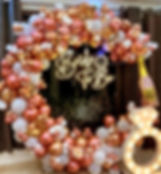 Bride To Be rose gold balloons, ring, and champagne bottle decor