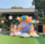 Baby shower setup with balloons and decor.