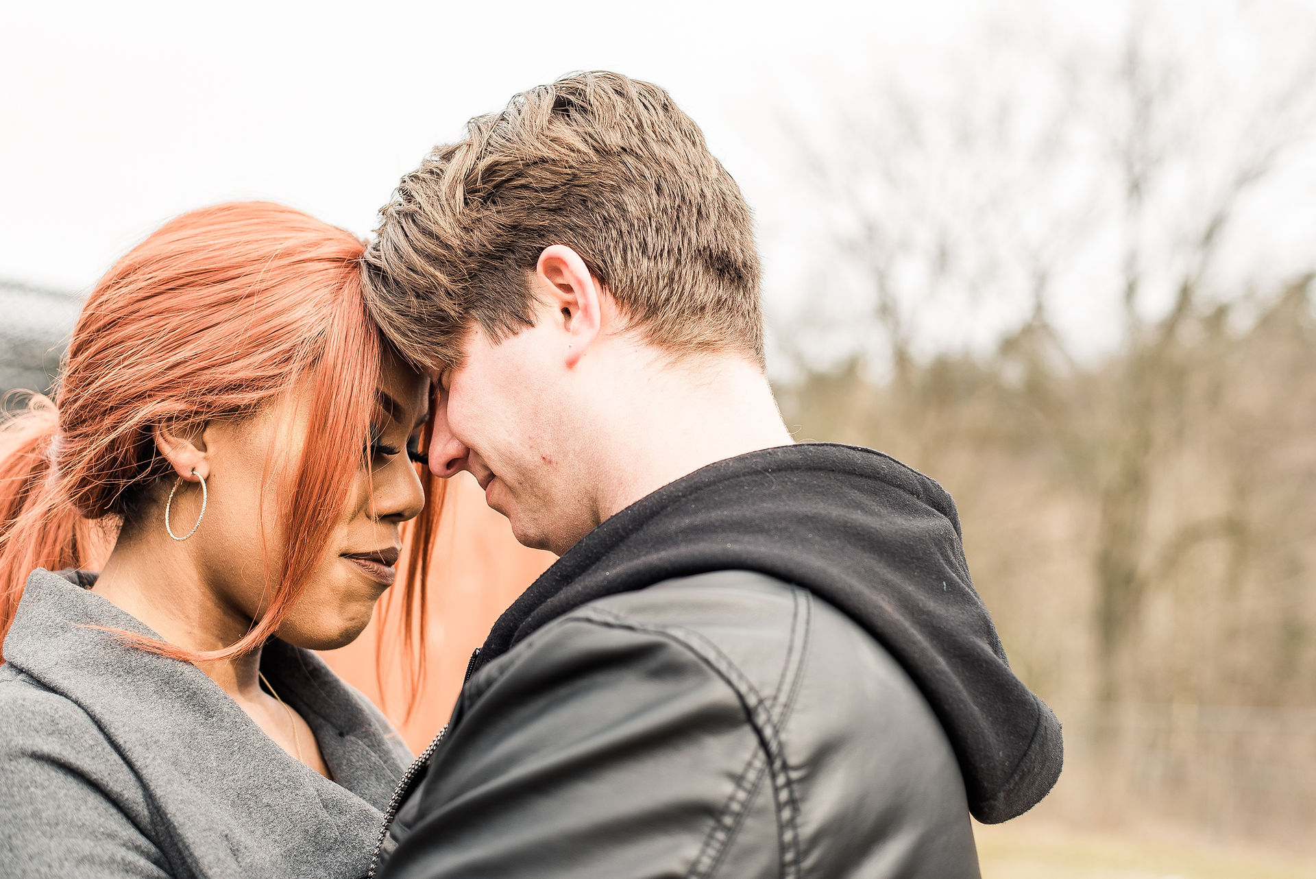 Couple touching foreheads at a zoo in Pennsylvania