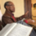 Bobby sitting down and speaking at an OFJ meeting.